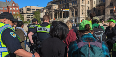 Person With Megaphone At UW Protests Revealed Says Report